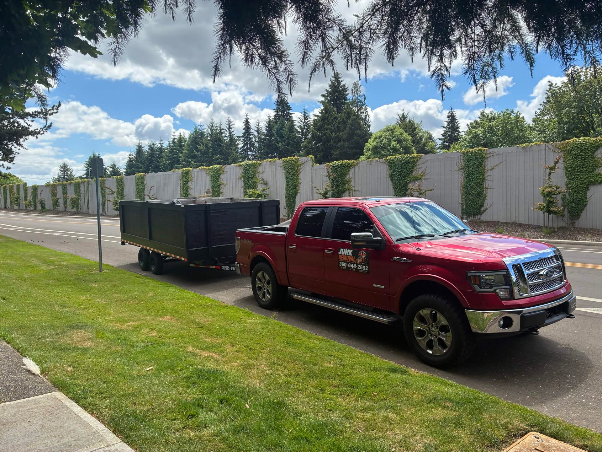 Haul Away Junk Removal truck and trailer loaded for junk removal service